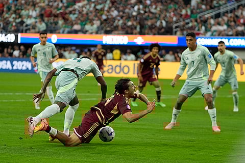 Julian Quinonez, left, fouls Jon Aramburu